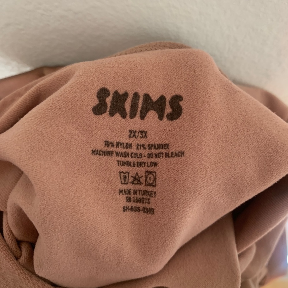 SKIMS Sculpting Bodysuit Mid-thigh with Open Gusset in Sienna